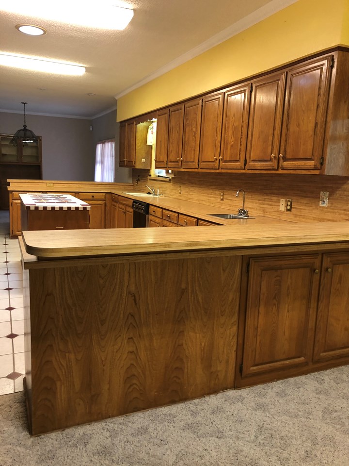 look at all the cabinets bright cheery kitchen with easy access to dining and breakfast nook