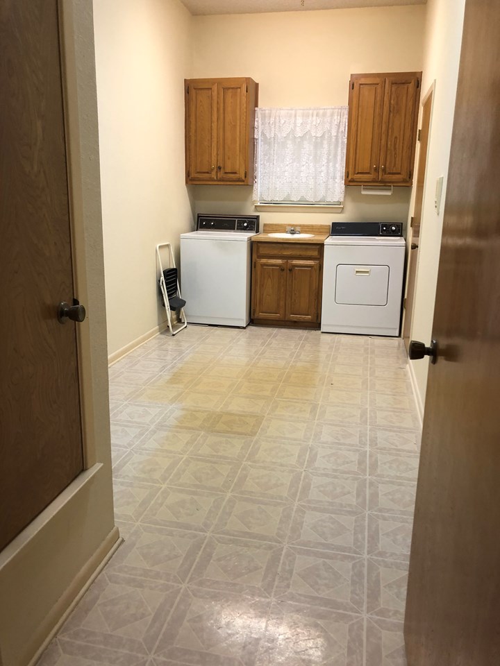 huge utility room    room for a freezer and extra refrigerator and a big closet also