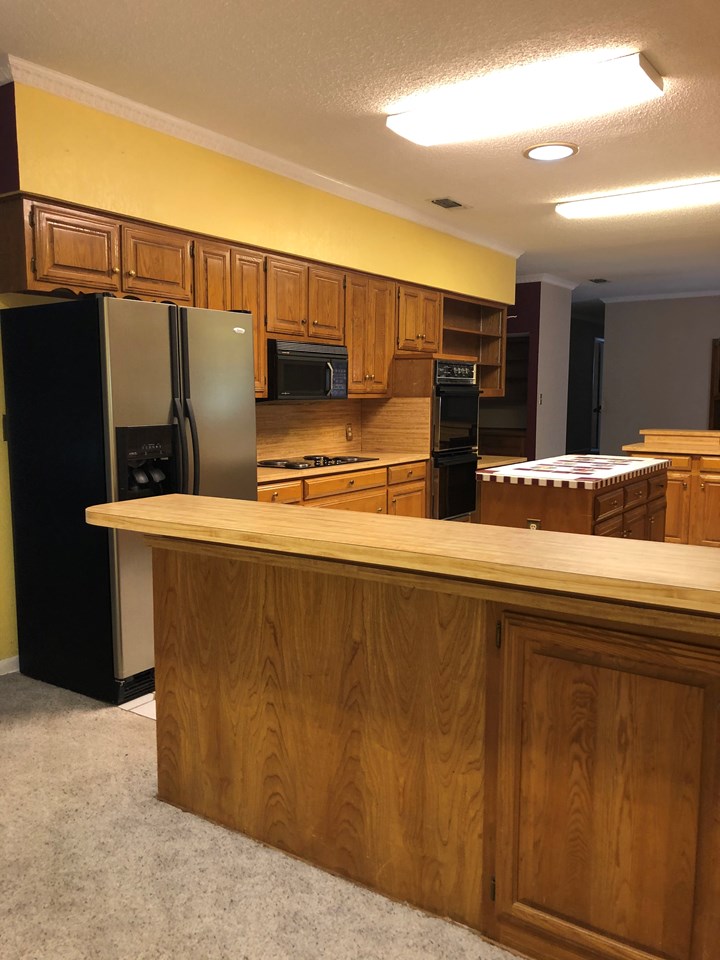 refrigerator included  refrigerator, stove, double ovens and an island  for even more work space, also a planning desk